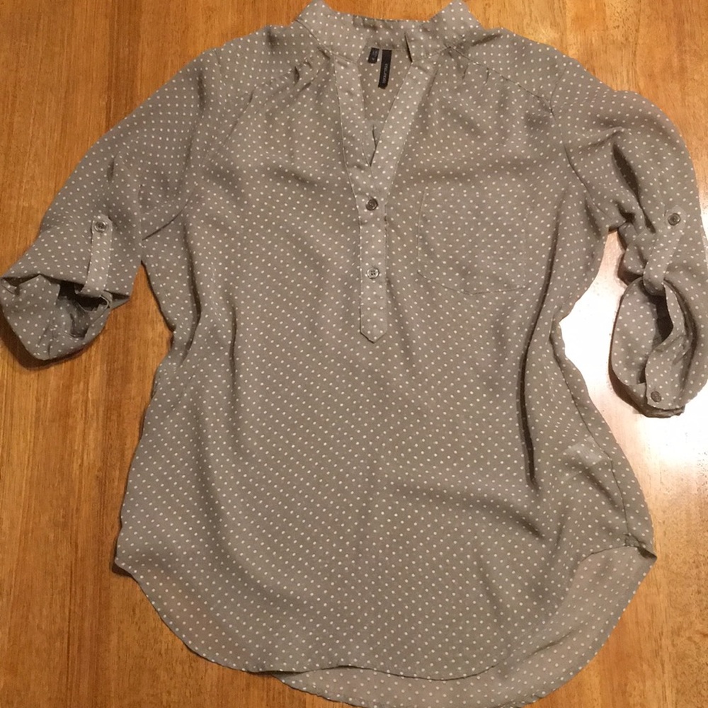 Polka dot blouse.